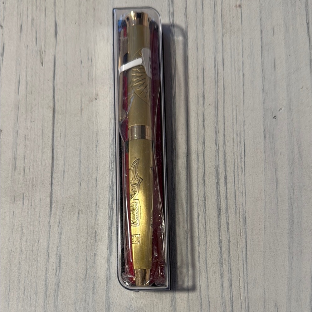 Gold Pen with Red Accents
